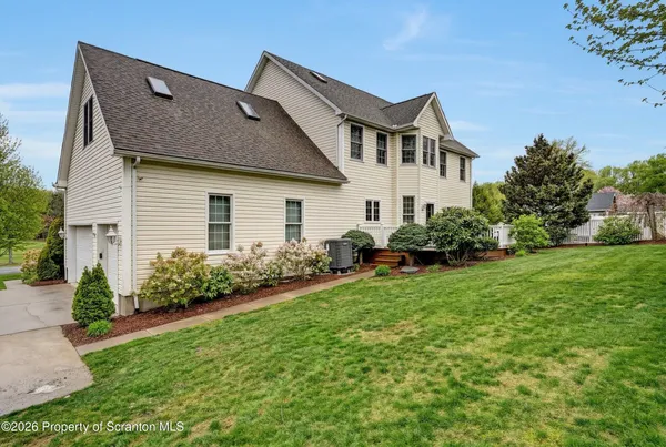 an outdoor space with furniture and garden