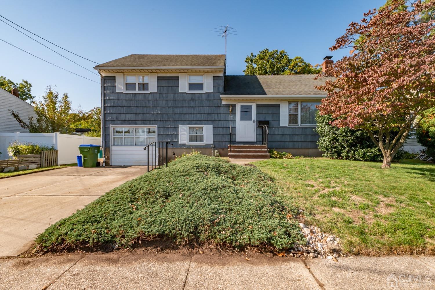 1 Wynn Road Edison, NJ 08817 - Photo 1 of 24 a front view of a house with a yard