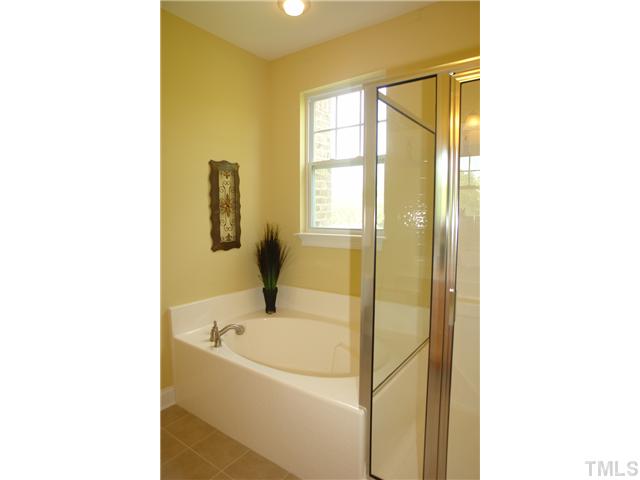 3811 Lunceston Way, Unit 203 Raleigh, NC 27613 - Photo 16 of 20 a bathroom with a tub and shower