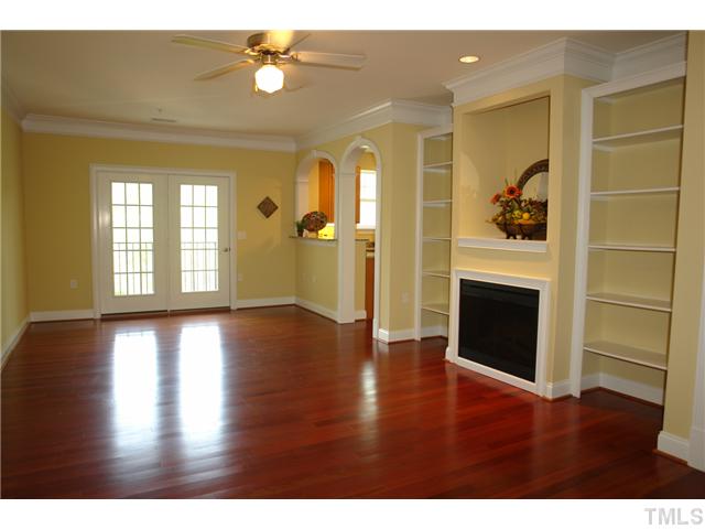 3811 Lunceston Way, Unit 203 Raleigh, NC 27613 - Photo 4 of 20 a view of an empty room with window and wooden floor