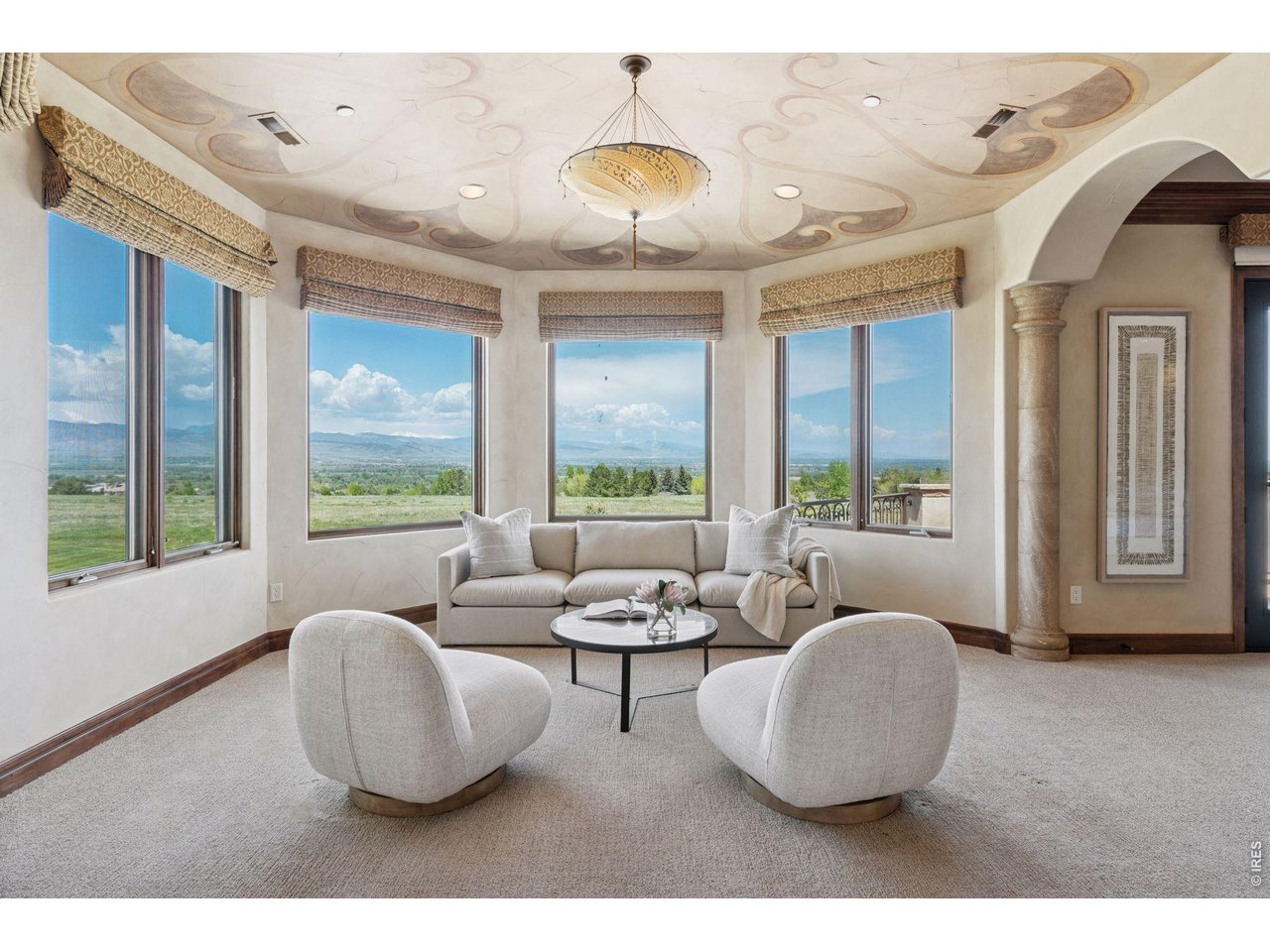 6541 Legend Ridge Trail Niwot, CO 80503 - Photo 24 of 45 The Primary Suite is its own elegant wing with the most amazing views from its own sitting room with electric Lutron shades and arched vestibule double doors.