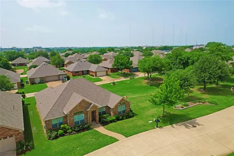 an aerial view of house with yard