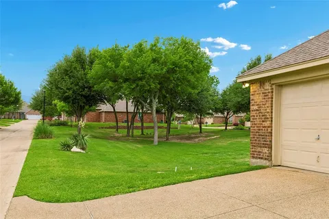 a view of a backyard with a garden