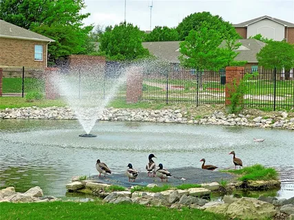 a view of a lake with a nearby house