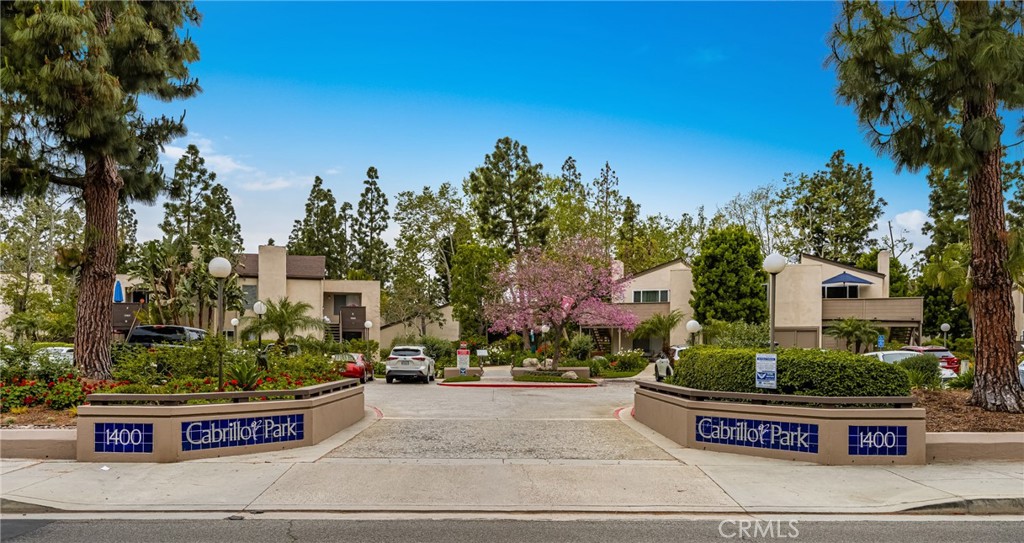 1420 E Cabrillo Park Drive, Unit E Santa Ana, CA 92701 - Photo 1 of 46 a front view of a house with yard