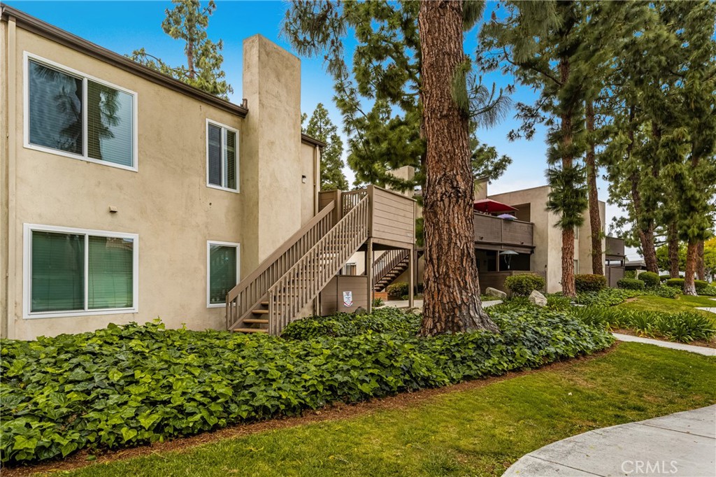 1420 E Cabrillo Park Drive, Unit E Santa Ana, CA 92701 - Photo 12 of 46 a front view of a house with garden