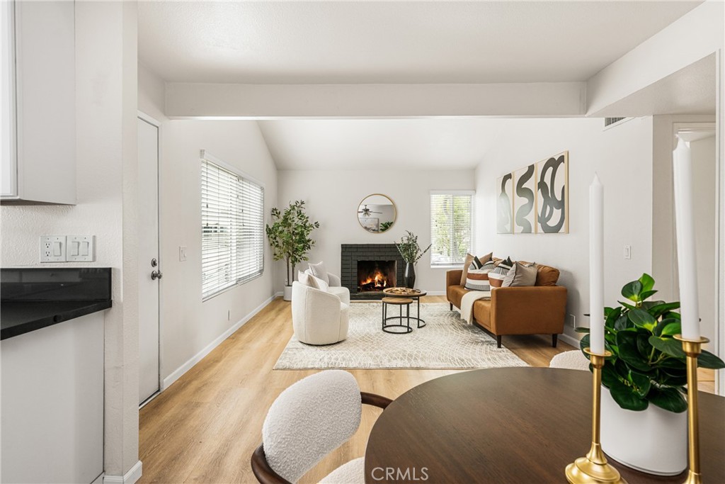 1420 E Cabrillo Park Drive, Unit E Santa Ana, CA 92701 - Photo 18 of 46 a living room with furniture and a fireplace