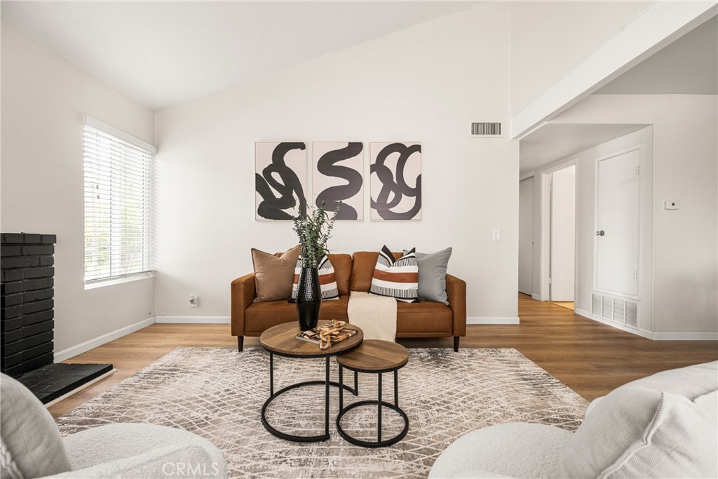 1420 E Cabrillo Park Drive, Unit E Santa Ana, CA 92701 - Photo 20 of 46 a living room with furniture and a window