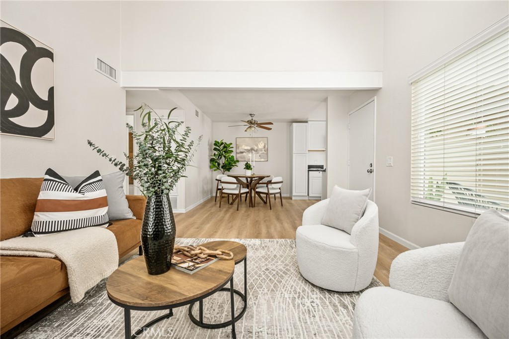 1420 E Cabrillo Park Drive, Unit E Santa Ana, CA 92701 - Photo 21 of 46 a living room with furniture and a potted plant