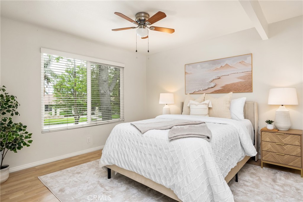 1420 E Cabrillo Park Drive, Unit E Santa Ana, CA 92701 - Photo 28 of 46 a bedroom with bed and window