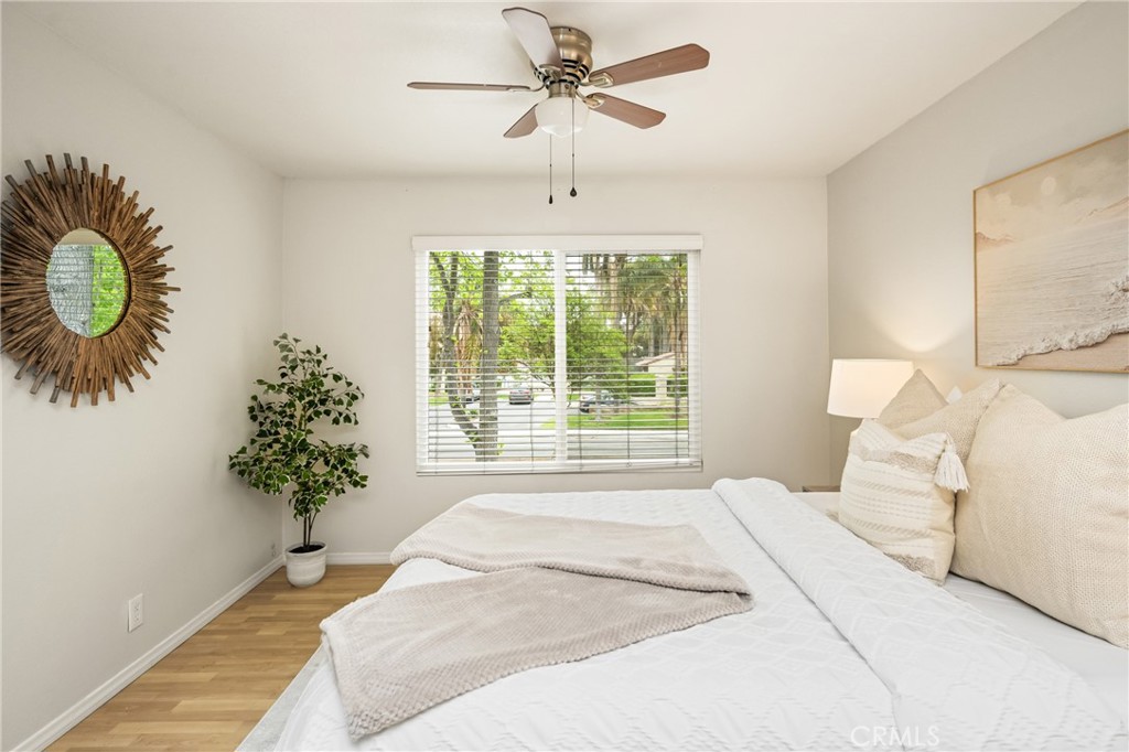 1420 E Cabrillo Park Drive, Unit E Santa Ana, CA 92701 - Photo 30 of 46 a bedroom with a bed and a window