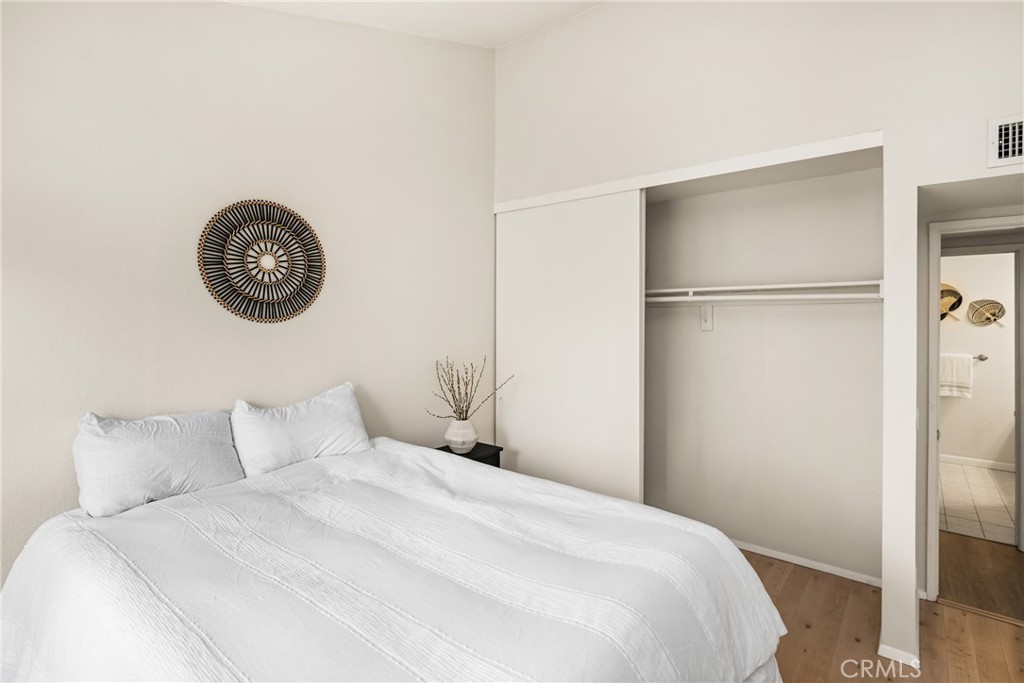 1420 E Cabrillo Park Drive, Unit E Santa Ana, CA 92701 - Photo 35 of 46 a bedroom with a bed and a table