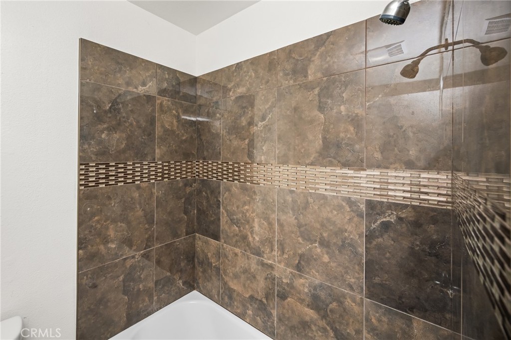 1420 E Cabrillo Park Drive, Unit E Santa Ana, CA 92701 - Photo 38 of 46 a bathroom with a shower