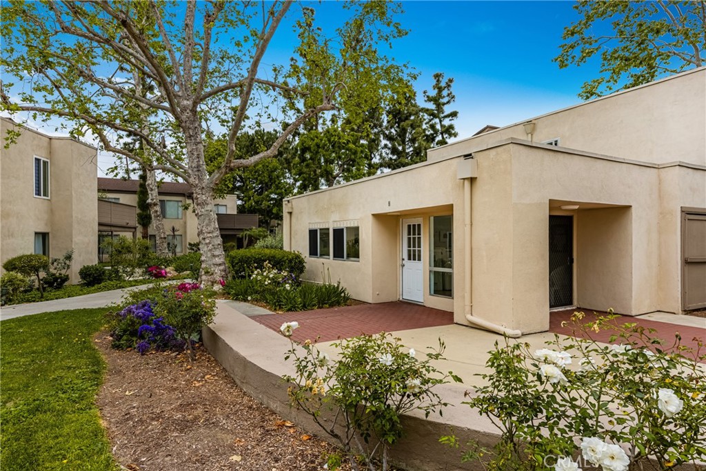 1420 E Cabrillo Park Drive, Unit E Santa Ana, CA 92701 - Photo 39 of 46 a view of a house with yard and garden