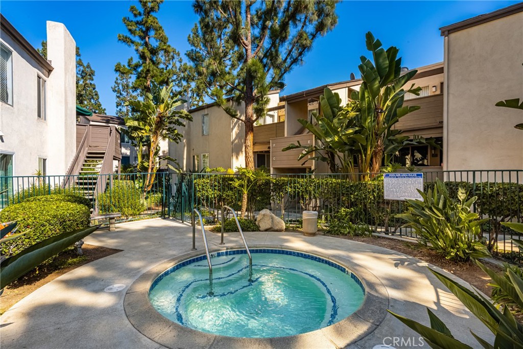 1420 E Cabrillo Park Drive, Unit E Santa Ana, CA 92701 - Photo 41 of 46 a view of a swimming pool with a patio