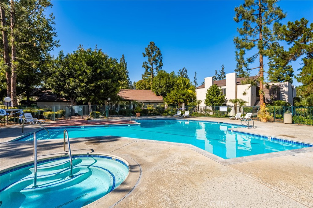 1420 E Cabrillo Park Drive, Unit E Santa Ana, CA 92701 - Photo 43 of 46 a swimming pool with outdoor seating and yard