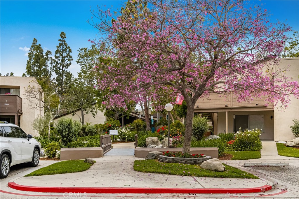 1420 E Cabrillo Park Drive, Unit E Santa Ana, CA 92701 - Photo 8 of 46 a front view of a house with a yard