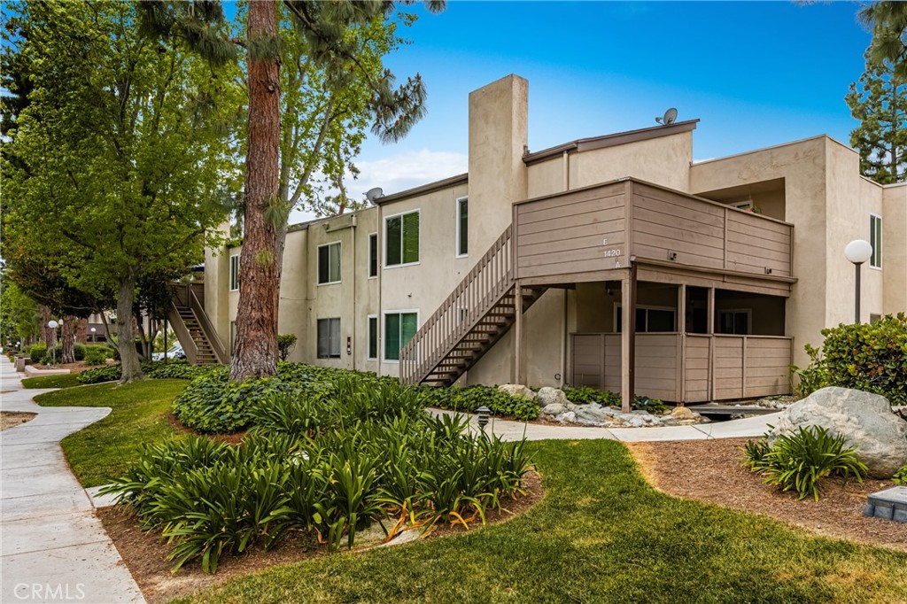 1420 E Cabrillo Park Drive, Unit E Santa Ana, CA 92701 - Photo 10 of 46 a view of a house with a yard