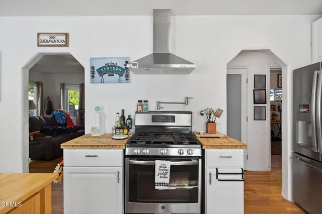 a kitchen with a stove and a refrigerator