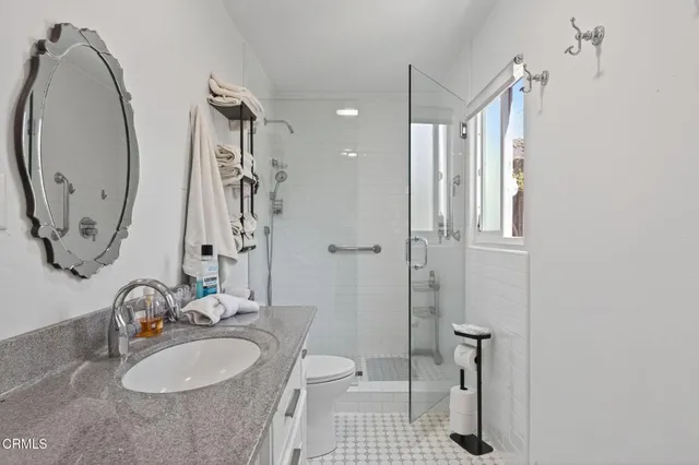 a bathroom with a sink double vanity and a mirror