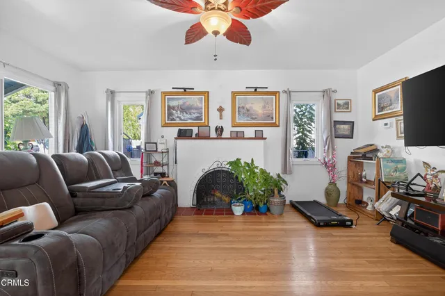 a living room with furniture and a fireplace