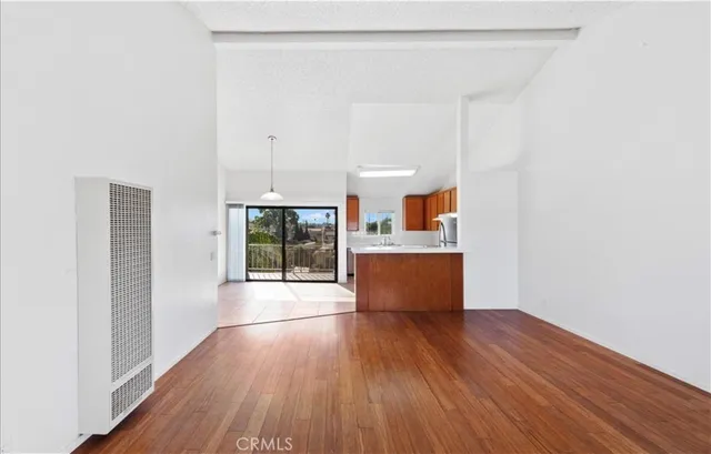 a view of kitchen and wooden floor
