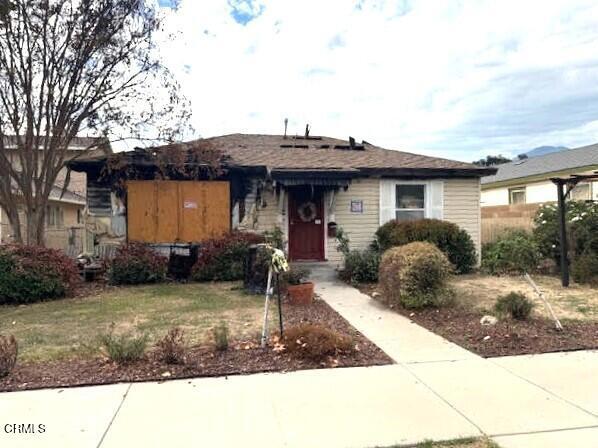 639 Mountain View Street Fillmore, CA 93015 - Photo 1 of 11 a front view of a house with garden