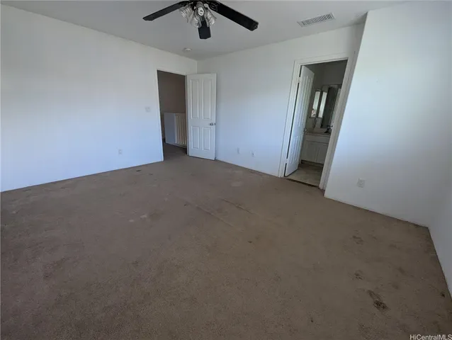 an empty room with a empty space and windows