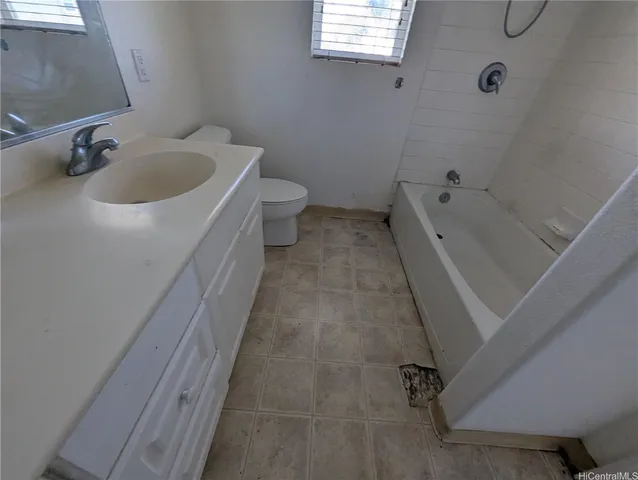 a bathroom with a sink and toilet