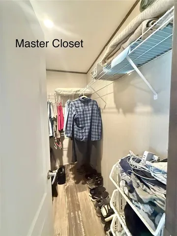 a kitchen with a table chairs refrigerator and window