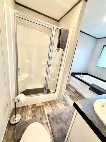 a bathroom with a sink and shower