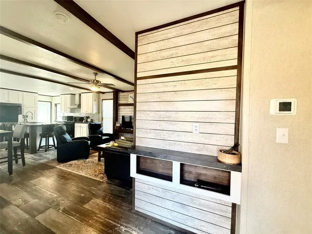 a living room with furniture window and wooden floor