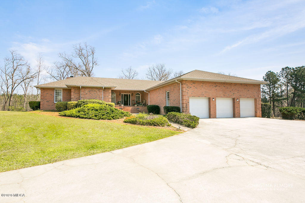 2676 Graham Road Gray, GA 31032 - Photo 1 of 1 a front view of a house with yard and green space