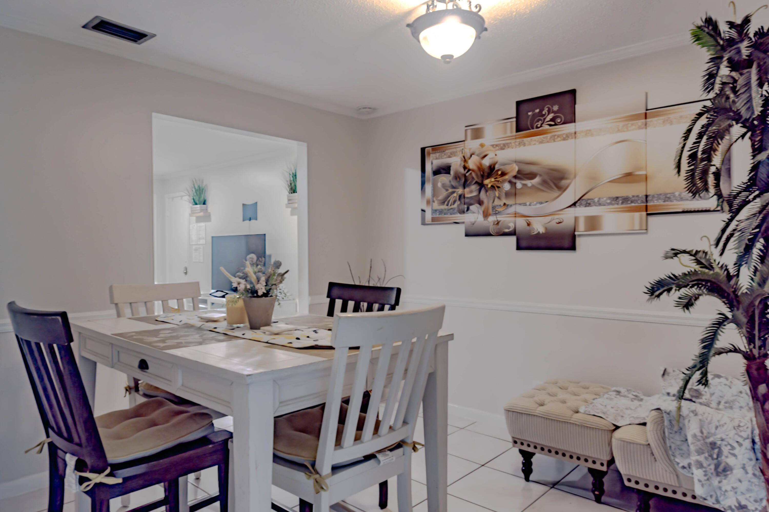1230 Block Island Road, Unit 1 Wellington, FL 33414 - Photo 7 of 17 a view of a dining room with furniture and wooden floor