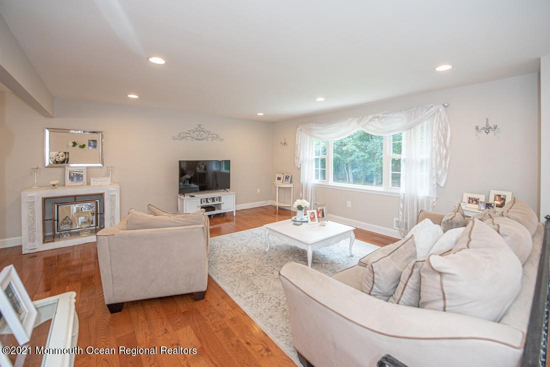 67 North Boston Road Jackson, NJ 08527 - Photo 14 of 52 a living room with furniture and a flat screen tv