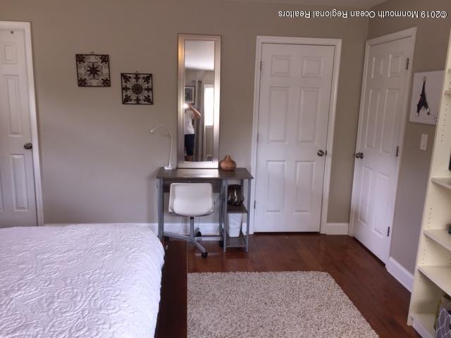 67 North Boston Road Jackson, NJ 08527 - Photo 22 of 52 a bedroom with a bed and a mirror