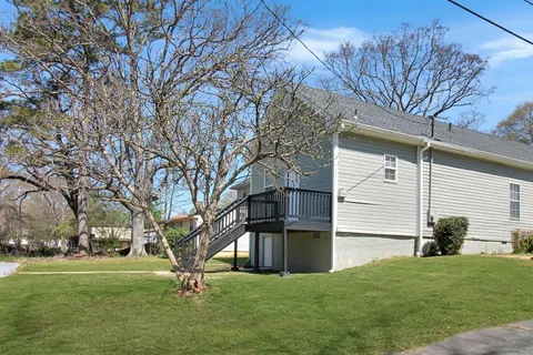 a view of a backyard with large trees