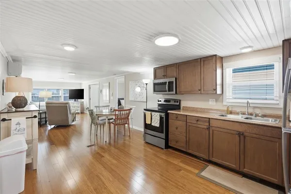 a kitchen with lots of counter top space and dining table