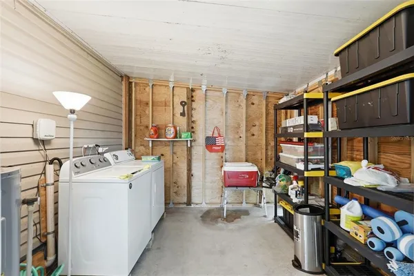 a utility room with dryer and washer