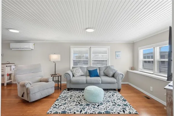 a living room with furniture and a rug