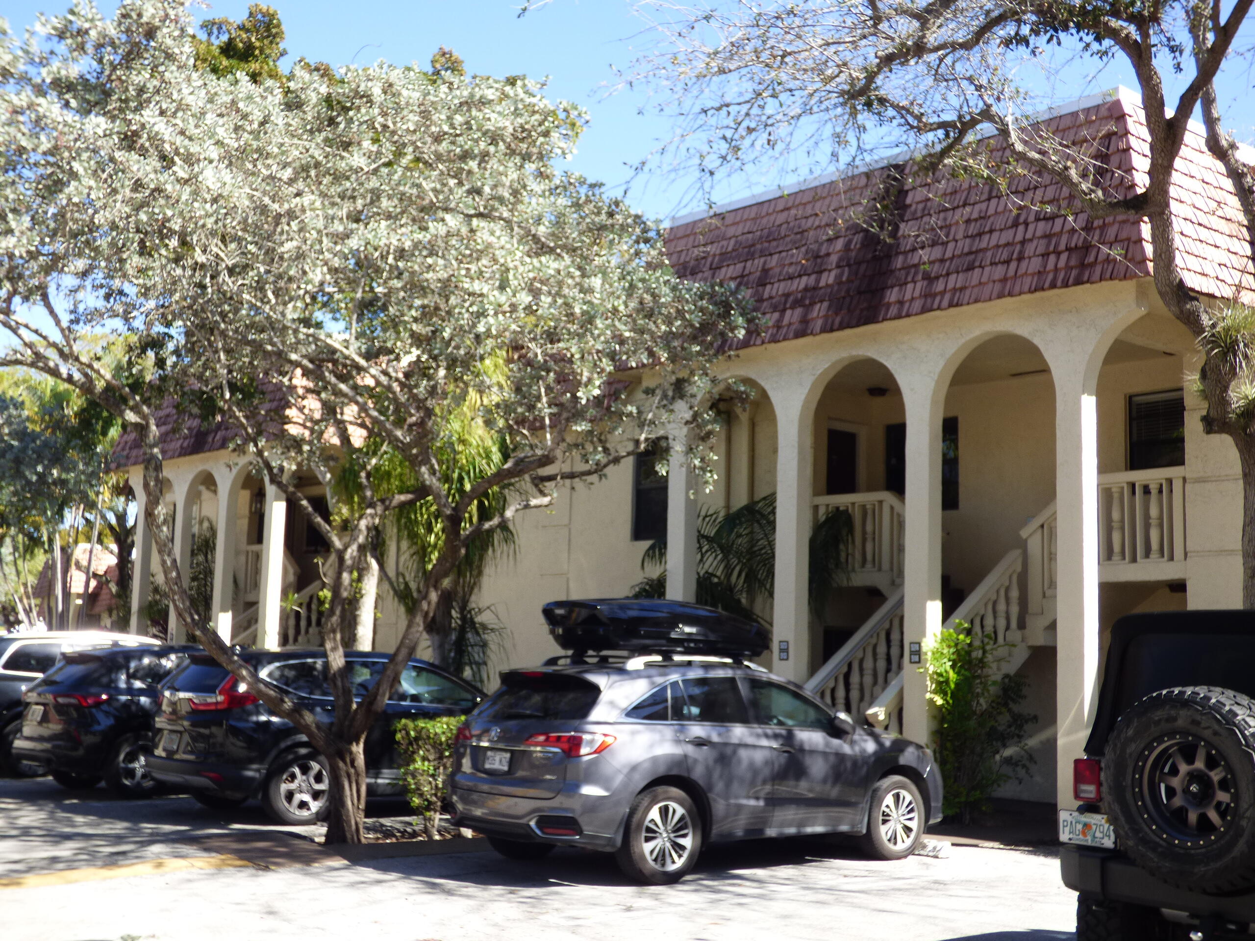 a front view of a house with parking area