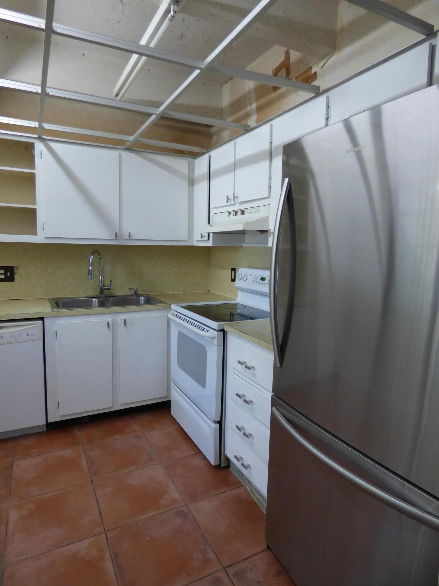 132 South Cypress Road, Unit 514 Pompano Beach, FL 33060 - Photo 12 of 48 a kitchen with stainless steel appliances a refrigerator and a cabinets