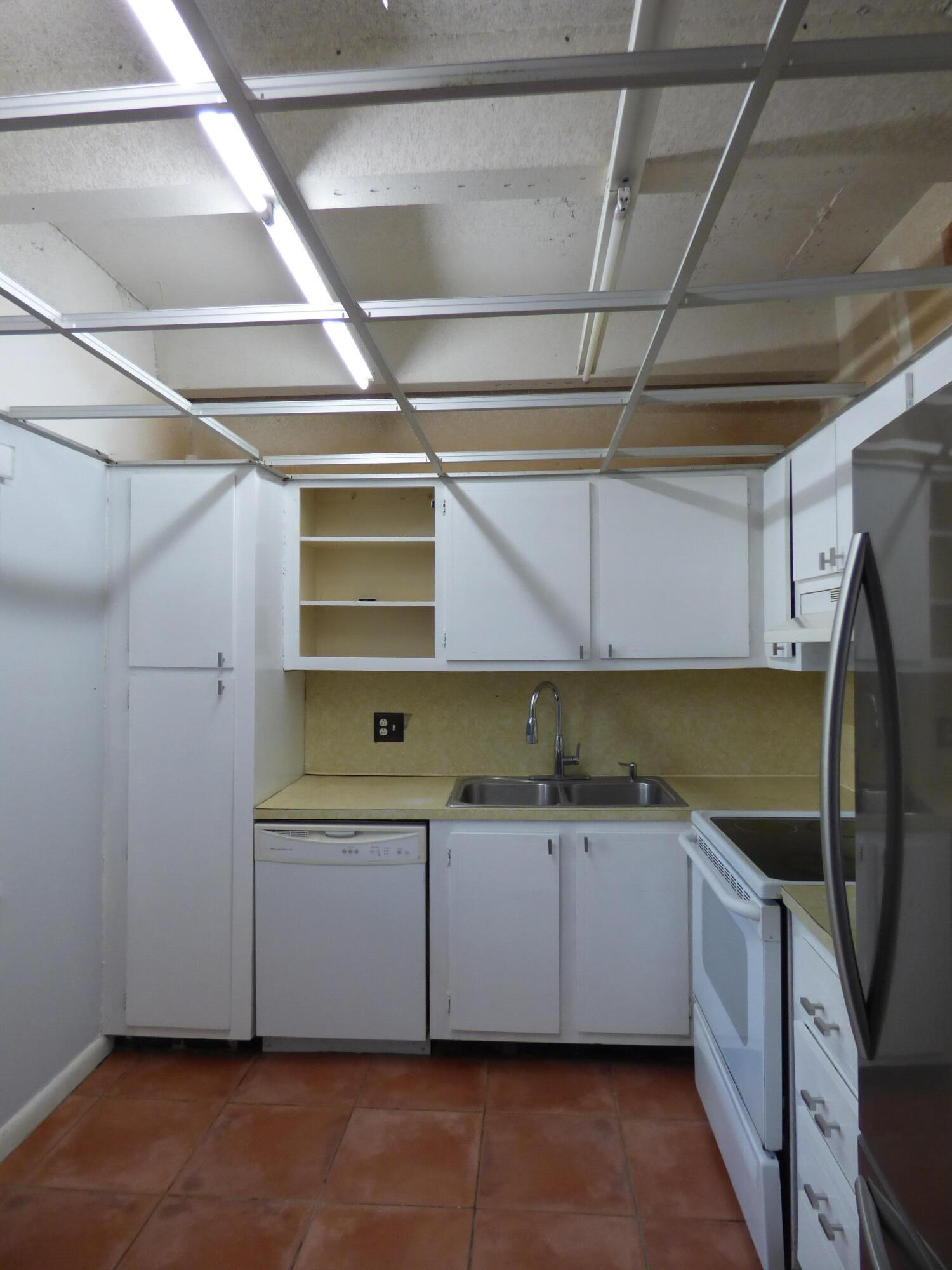 132 South Cypress Road, Unit 514 Pompano Beach, FL 33060 - Photo 13 of 48 a kitchen with a sink a counter space cabinets and appliances