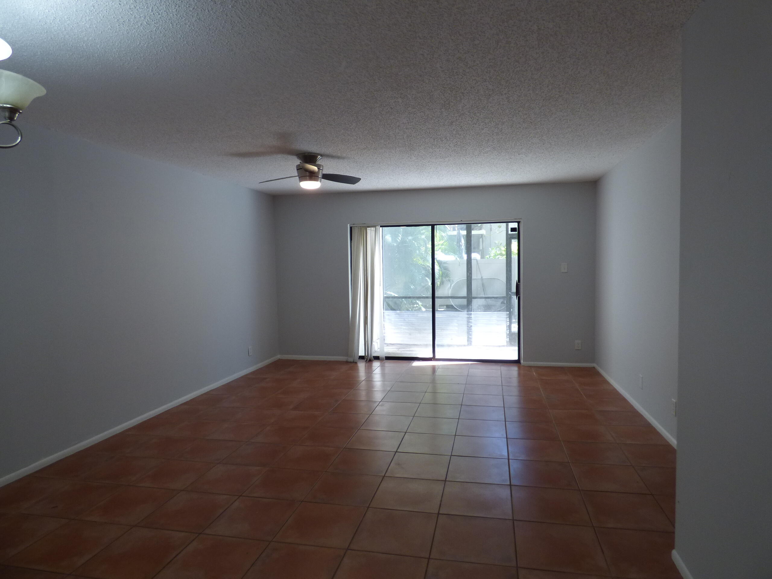 132 South Cypress Road, Unit 514 Pompano Beach, FL 33060 - Photo 16 of 48 an empty room with a empty space and a window