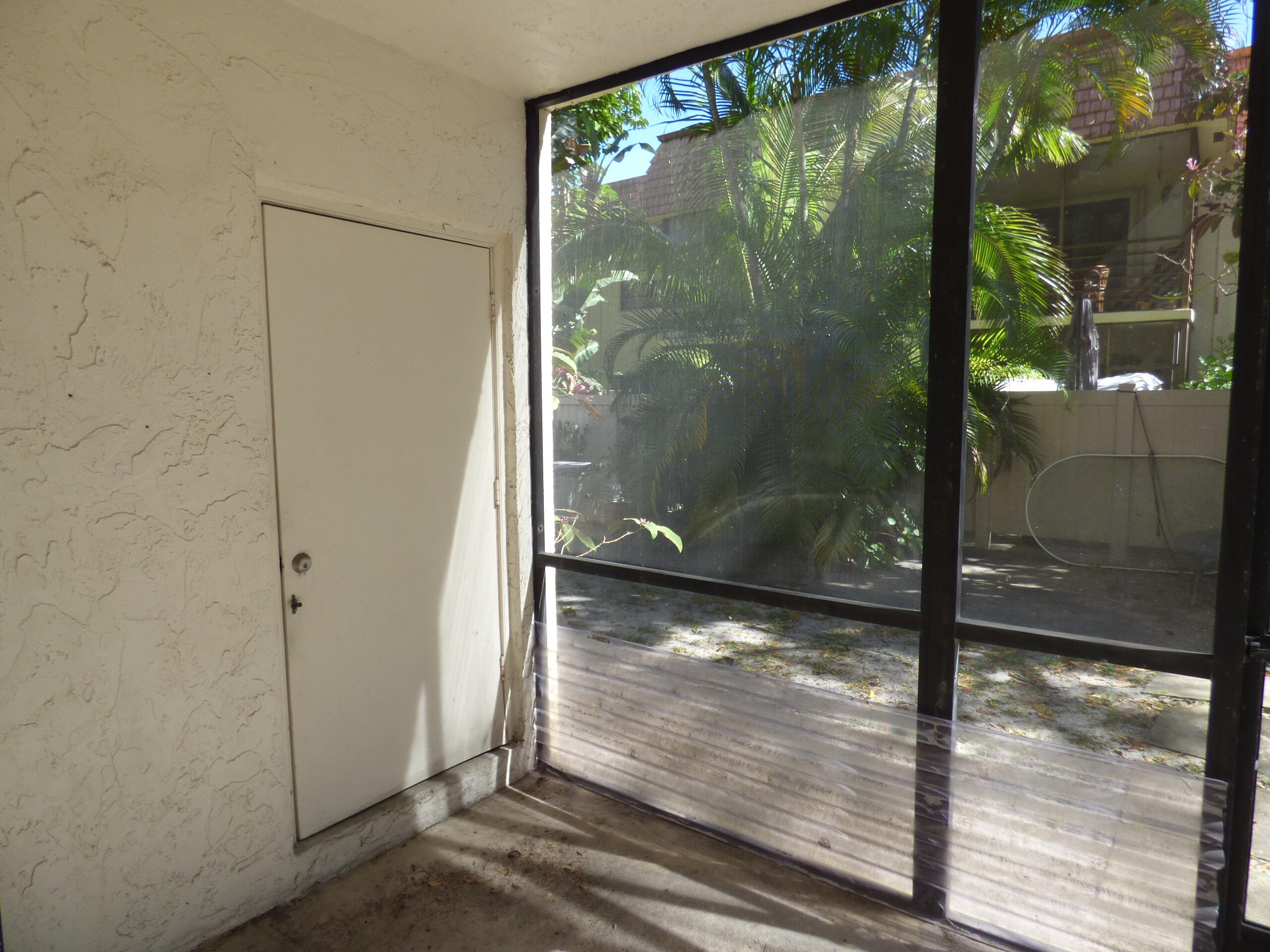 132 South Cypress Road, Unit 514 Pompano Beach, FL 33060 - Photo 19 of 48 a bathroom with a glass shower door