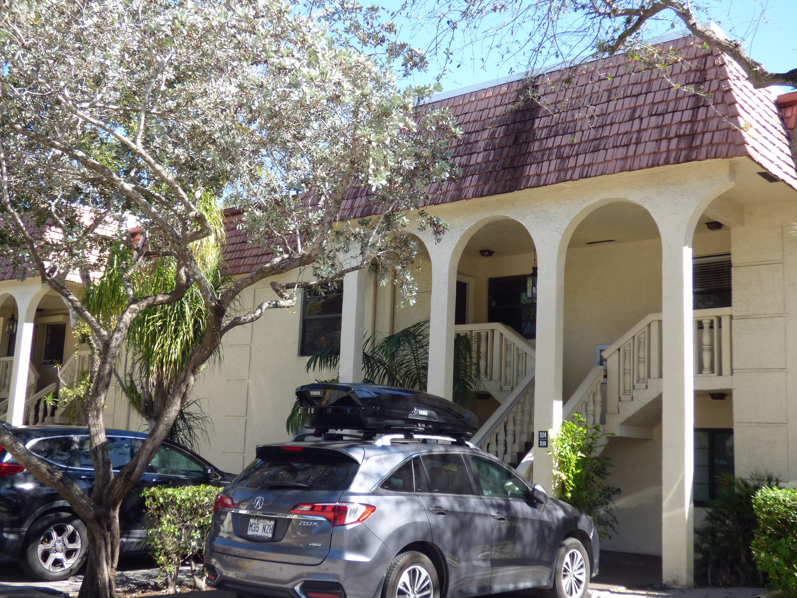 132 South Cypress Road, Unit 514 Pompano Beach, FL 33060 - Photo 2 of 48 a front view of a house with parking