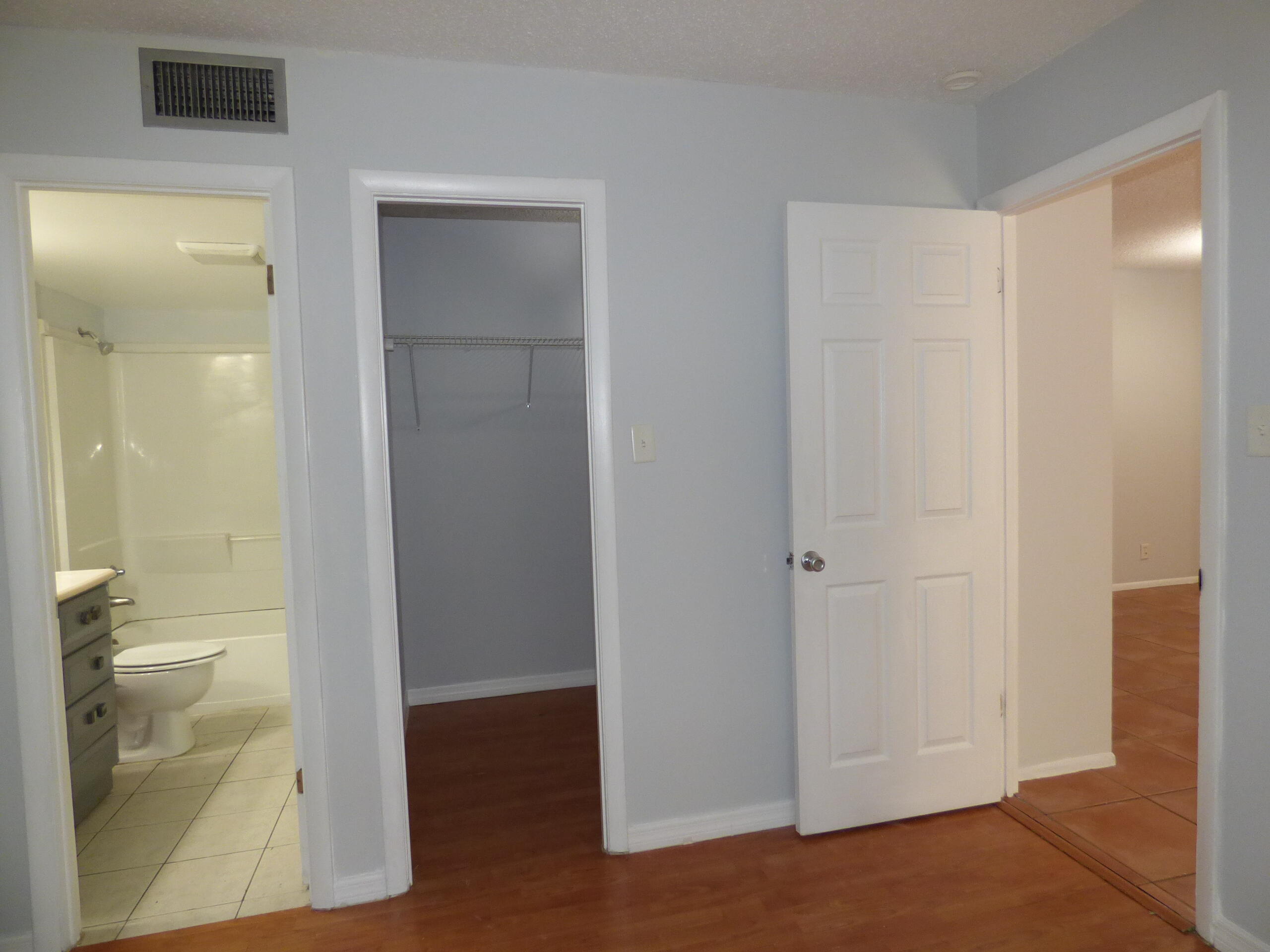 132 South Cypress Road, Unit 514 Pompano Beach, FL 33060 - Photo 26 of 48 a view of a bathroom from a hallway