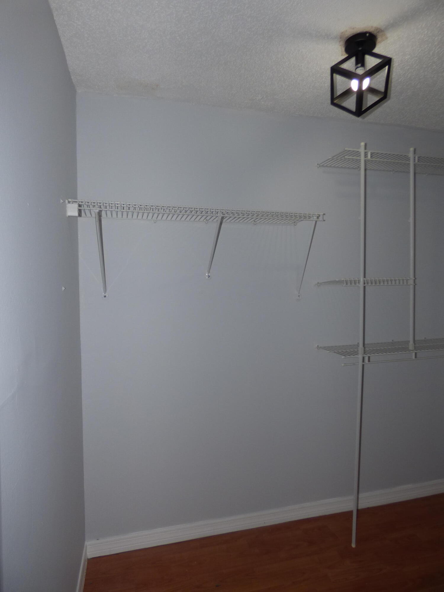 132 South Cypress Road, Unit 514 Pompano Beach, FL 33060 - Photo 28 of 48 a view of a room with racks on the wall