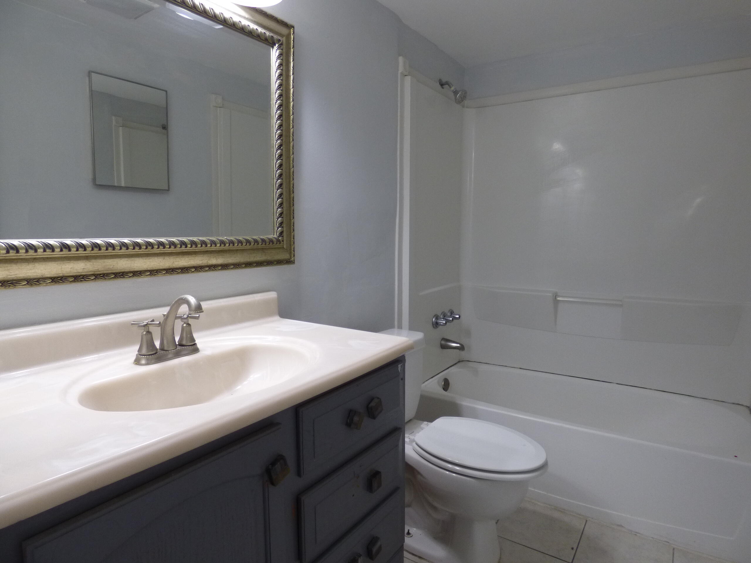 132 South Cypress Road, Unit 514 Pompano Beach, FL 33060 - Photo 30 of 48 a bathroom with a sink a toilet and shower