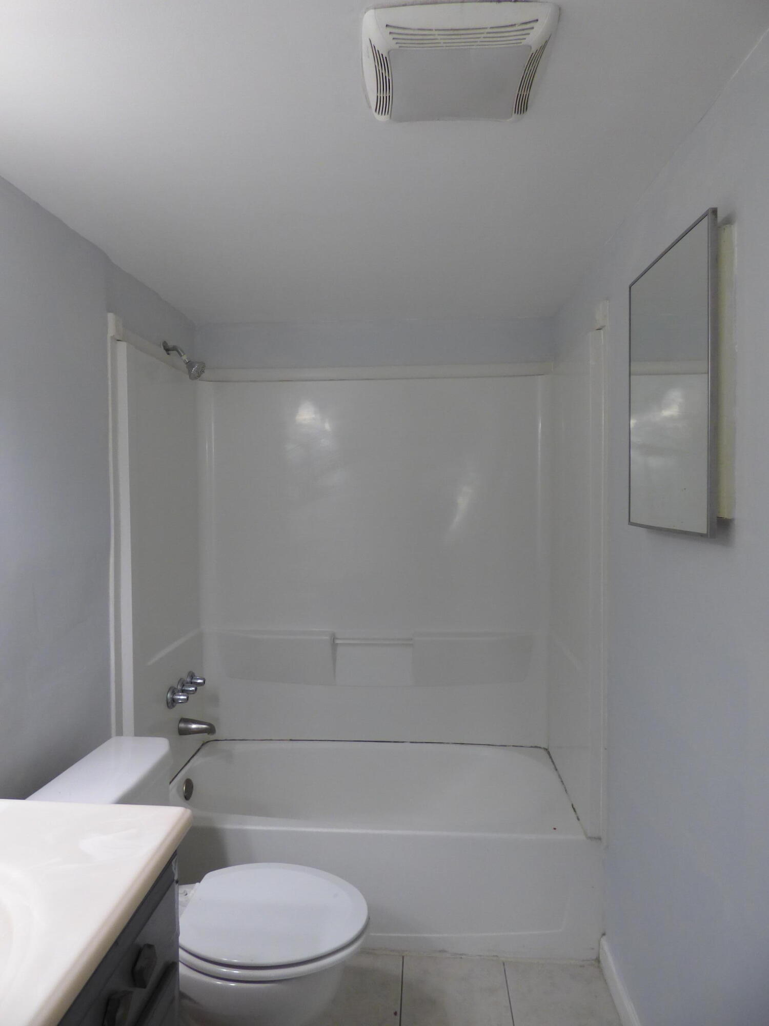 132 South Cypress Road, Unit 514 Pompano Beach, FL 33060 - Photo 32 of 48 a bathroom with a toilet a sink and bathtub